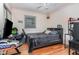 Bedroom with a wooden floor and ceiling fan at 118 Lynn Rd, Durham, NC 27703
