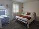 Cozy bedroom with a stylish bed, desk and natural light, offering a peaceful retreat at 118 Lynn Rd, Durham, NC 27703