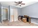Bedroom with closet, door, ceiling fan, and neutral walls at 118 Lynn Rd, Durham, NC 27703