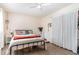 Comfortable bedroom with a queen-sized bed, ceiling fan, and natural lighting at 118 Lynn Rd, Durham, NC 27703