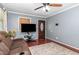 Cozy living room with plush seating, and natural light from a large window at 118 Lynn Rd, Durham, NC 27703