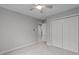 Neutral bedroom with a ceiling fan, closet, carpet flooring and neutral walls at 1208 Mossy Glade Cir, Apex, NC 27502