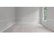 Clean, carpeted bedroom with neutral paint, white trim, and one window at 1208 Mossy Glade Cir, Apex, NC 27502