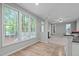 Bright dining room with wood floors and abundant light at 1208 Mossy Glade Cir, Apex, NC 27502