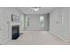 Spacious living room features a fireplace and multiple windows for natural light at 1208 Mossy Glade Cir, Apex, NC 27502