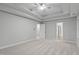 Spacious primary bedroom with carpet flooring, a ceiling fan, and neutral walls at 1208 Mossy Glade Cir, Apex, NC 27502