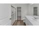 A full bathroom with a glass shower enclosure, modern vanity, and stylish fixtures, offers a spa-like retreat at 1208 Solace Way, Rolesville, NC 27571