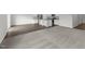 Open floor plan with kitchen, hardwood floors, and living room with carpet at 1208 Solace Way, Rolesville, NC 27571