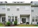 A charming backyard features a patio with seating, a grill, and lush green grass at 1213 Grenshaw Dr, Morrisville, NC 27560
