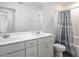 This bathroom boasts double sinks, cabinets, and shower/tub combo at 1213 Grenshaw Dr, Morrisville, NC 27560