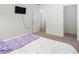This bedroom has wall-mounted TV and several doors at 1213 Grenshaw Dr, Morrisville, NC 27560