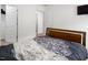 Cozy bedroom showcases neutral walls, carpet, and a dark wood bed with patterned linens at 1213 Grenshaw Dr, Morrisville, NC 27560