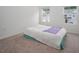 This bedroom has two windows with a double bed and carpet flooring at 1213 Grenshaw Dr, Morrisville, NC 27560