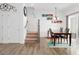 Open floor plan featuring dining area with table, and staircase to the upper level at 1213 Grenshaw Dr, Morrisville, NC 27560