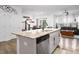 Open-concept kitchen flows into the dining and living area, creating a comfortable and social space at 1213 Grenshaw Dr, Morrisville, NC 27560