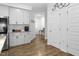 Bright, open kitchen featuring white cabinets, sleek countertops, and wood flooring throughout at 1213 Grenshaw Dr, Morrisville, NC 27560