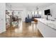 Open-concept living space featuring wood floors, modern furnishings, and abundant natural light at 1213 Grenshaw Dr, Morrisville, NC 27560