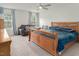 Spacious main bedroom boasts a comfortable seating area, large window, and ample natural light at 1213 Grenshaw Dr, Morrisville, NC 27560