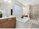 Luxurious bathroom with double vanities, soaking tub, and separate shower at 136 Shadow Hawk Dr, Durham, NC 27713