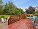 Outdoor deck with comfortable seating and a view of the well-maintained backyard at 136 Shadow Hawk Dr, Durham, NC 27713