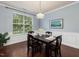 Dining area with hardwood floors, decorative chandelier and an abundance of natural light at 136 Shadow Hawk Dr, Durham, NC 27713