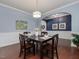 Dining area with hardwood floors, decorative chandelier and an abundance of natural light at 136 Shadow Hawk Dr, Durham, NC 27713