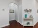 Elegant foyer with hardwood floors, arched doorway, and decorative accents at 136 Shadow Hawk Dr, Durham, NC 27713
