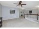 Bright upstairs hallway connects bedrooms and offers a spacious area for relaxation or play at 136 Shadow Hawk Dr, Durham, NC 27713