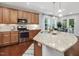 Updated kitchen featuring granite countertops, stainless steel appliances and natural wood cabinetry at 136 Shadow Hawk Dr, Durham, NC 27713