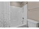Clean bathroom features a shower-tub combo with a white shower surround and neutral colored walls at 139 Carriage Hill Dr, Stem, NC 27581