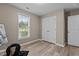 Neutral bedroom with updated flooring, double closets, and a window offering plenty of natural light at 139 Carriage Hill Dr, Stem, NC 27581