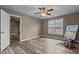 Spacious bedroom with wood-look flooring, neutral walls, and natural lighting at 139 Carriage Hill Dr, Stem, NC 27581