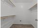 Walk-in closet featuring ample storage space with multiple rods for hanging clothes at 139 Carriage Hill Dr, Stem, NC 27581