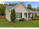 Well-maintained single-story home with manicured lawn, tidy landscaping, and inviting front porch at 139 Carriage Hill Dr, Stem, NC 27581