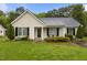 Charming single-story home with light siding, black shutters, and a well-maintained lawn at 139 Carriage Hill Dr, Stem, NC 27581