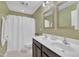 Neutral bathroom with a shower-tub combo and double sink vanity at 1920 Bright Kannon Way, Wendell, NC 27591