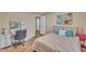 Bright bedroom with wood floors, makeup vanity, and natural light at 1920 Bright Kannon Way, Wendell, NC 27591