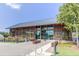 Modern clubhouse with horizontal wood beam elements, glass windows, and ample parking spaces in a well-maintained environment at 1920 Bright Kannon Way, Wendell, NC 27591
