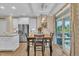 Bright dining area with modern chandelier, glass patio doors, and backyard views at 1920 Bright Kannon Way, Wendell, NC 27591