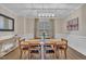 Elegant dining room with a wooden table, stylish chairs, and decorative window treatments at 1920 Bright Kannon Way, Wendell, NC 27591