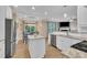 Open kitchen with stainless steel appliances, granite countertops, and an island at 1920 Bright Kannon Way, Wendell, NC 27591