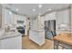 Well-lit kitchen with stainless steel appliances, granite countertops, and white cabinets at 1920 Bright Kannon Way, Wendell, NC 27591