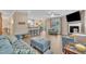 Bright living room with a fireplace, ceiling fan, comfortable seating, and a kitchen view at 1920 Bright Kannon Way, Wendell, NC 27591