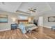Main bedroom with tray ceiling, ceiling fan, and ensuite bathroom at 1920 Bright Kannon Way, Wendell, NC 27591