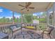 Screened porch with seating, ceiling fan, and views of landscaped backyard at 1920 Bright Kannon Way, Wendell, NC 27591