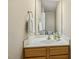 Well-lit bathroom featuring a vanity with white countertop and a framed mirror at 1984 Sadler Ave, Creedmoor, NC 27522
