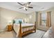 Cozy bedroom with a ceiling fan, neutral walls, and a window that provides natural light at 1984 Sadler Ave, Creedmoor, NC 27522