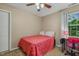 Cozy bedroom featuring a ceiling fan, neutral walls, and a comfortable desk at 1984 Sadler Ave, Creedmoor, NC 27522