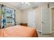 Bedroom featuring a cozy bed, colorful curtains, and a ceiling fan for comfortable living at 1984 Sadler Ave, Creedmoor, NC 27522
