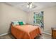 Comfortable bedroom featuring a ceiling fan, neutral walls, and a window providing natural light at 1984 Sadler Ave, Creedmoor, NC 27522